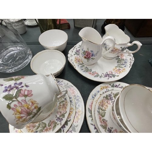 64 - A QUANTITY OF CHINA TEAWARE TO INCLUDE PARAGON 'COUNTRY LANE' TRIOS, PLATES, SUGAR BOWL AND CREAM JU... 