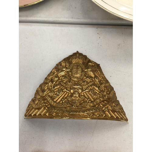 225A - A BRASS BADGE FROM AN ARMY HELMET