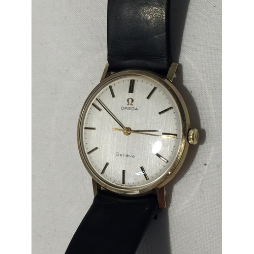 502A - AN OMEGA GENTLEMAN'S WRIST WATCH WITH 9 CARAT GOLD CASE AND LEATHER STRAP (ENGRAVED TO THE BACK PLAT... 