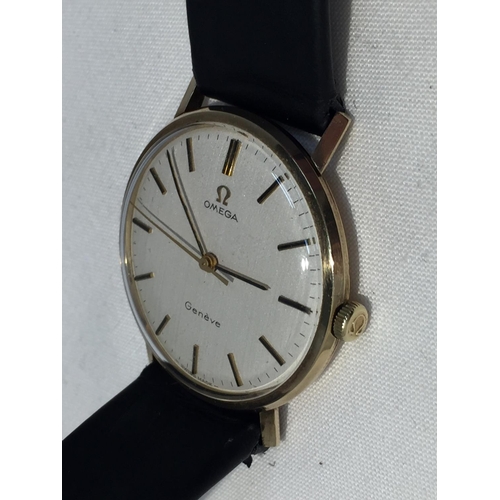 502A - AN OMEGA GENTLEMAN'S WRIST WATCH WITH 9 CARAT GOLD CASE AND LEATHER STRAP (ENGRAVED TO THE BACK PLAT... 