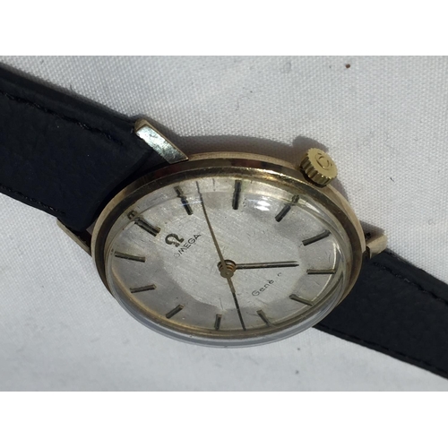 503A - AN OMEGA GENTLEMAN'S WRIST WATCH WITH 9 CARAT GOLD CASE AND LEATHER STRAP