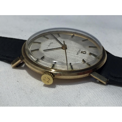 503A - AN OMEGA GENTLEMAN'S WRIST WATCH WITH 9 CARAT GOLD CASE AND LEATHER STRAP