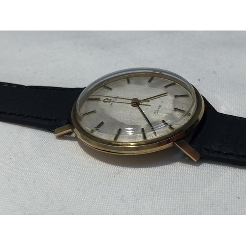 503A - AN OMEGA GENTLEMAN'S WRIST WATCH WITH 9 CARAT GOLD CASE AND LEATHER STRAP