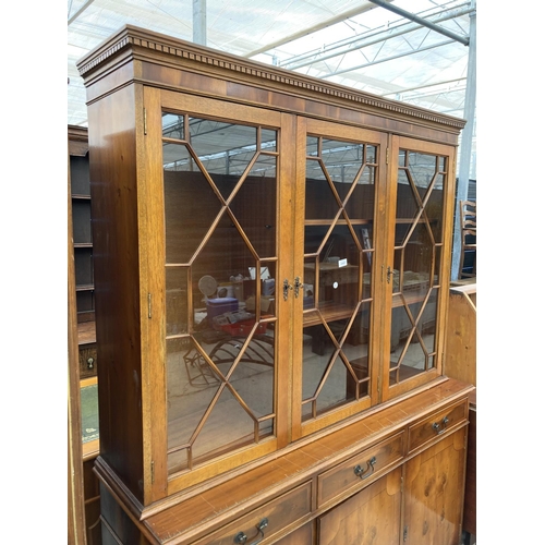 2460 - A MODERN YEW WOOD GLASED BOOKCASE ON BASE 56