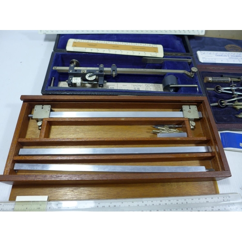 306 - A COLLECTION OF NAVAL ARCHITECTS DRAWING INSTRUMENTS, TO INCLUDE A PLANIMETER, RULERS, SLIDE RULES, ... 