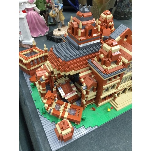 211 - A QUANTITY OF SMALL LEGO STYLE BRICKS AND BASE BUILT AS A TOWN HALL