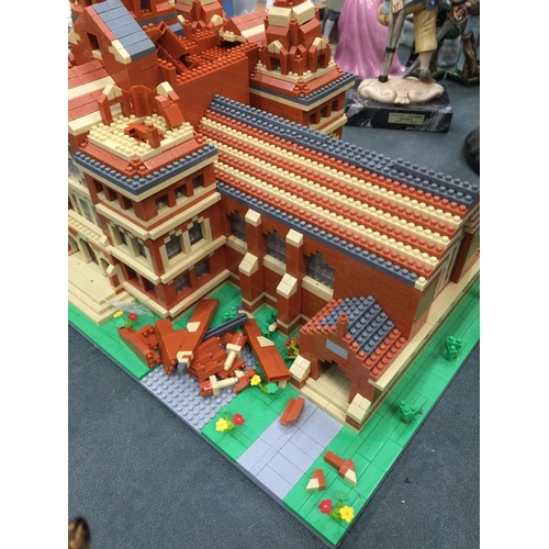 211 - A QUANTITY OF SMALL LEGO STYLE BRICKS AND BASE BUILT AS A TOWN HALL