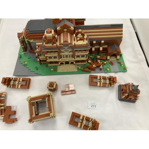211 - A QUANTITY OF SMALL LEGO STYLE BRICKS AND BASE BUILT AS A TOWN HALL