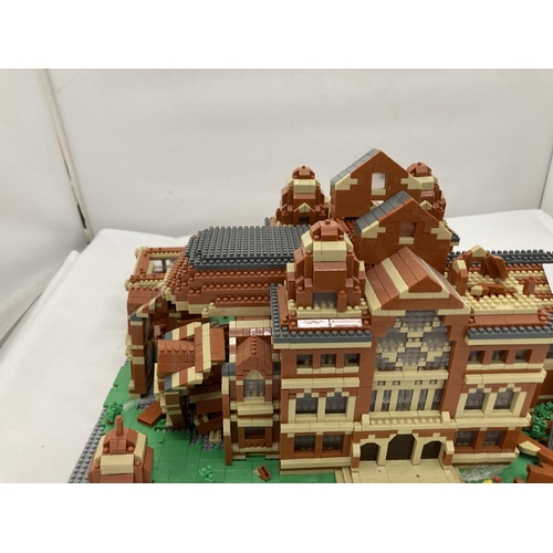211 - A QUANTITY OF SMALL LEGO STYLE BRICKS AND BASE BUILT AS A TOWN HALL