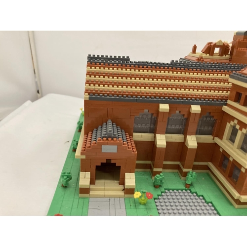 211 - A QUANTITY OF SMALL LEGO STYLE BRICKS AND BASE BUILT AS A TOWN HALL