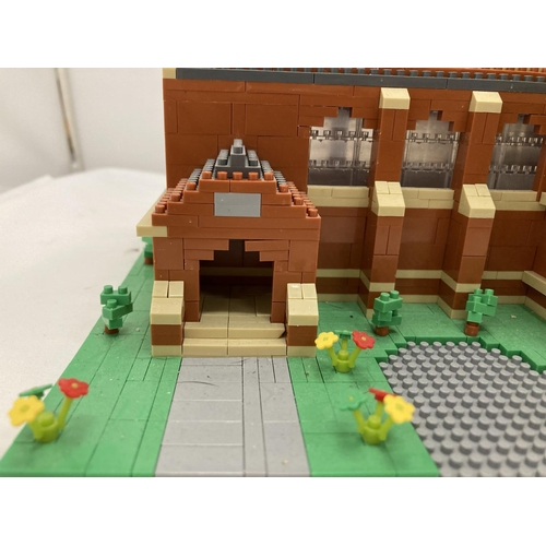 211 - A QUANTITY OF SMALL LEGO STYLE BRICKS AND BASE BUILT AS A TOWN HALL