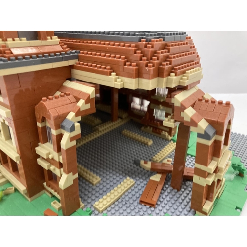 211 - A QUANTITY OF SMALL LEGO STYLE BRICKS AND BASE BUILT AS A TOWN HALL