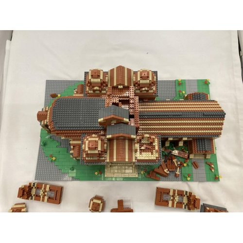 211 - A QUANTITY OF SMALL LEGO STYLE BRICKS AND BASE BUILT AS A TOWN HALL