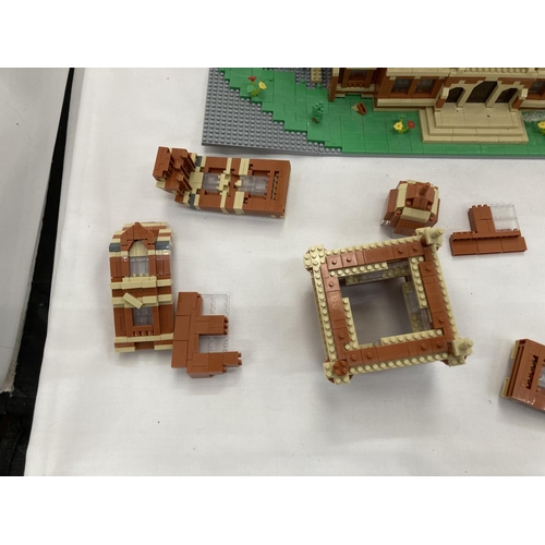 211 - A QUANTITY OF SMALL LEGO STYLE BRICKS AND BASE BUILT AS A TOWN HALL