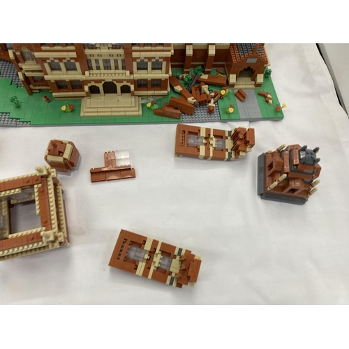 211 - A QUANTITY OF SMALL LEGO STYLE BRICKS AND BASE BUILT AS A TOWN HALL