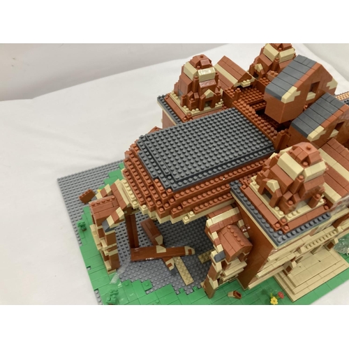 211 - A QUANTITY OF SMALL LEGO STYLE BRICKS AND BASE BUILT AS A TOWN HALL