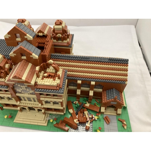 211 - A QUANTITY OF SMALL LEGO STYLE BRICKS AND BASE BUILT AS A TOWN HALL
