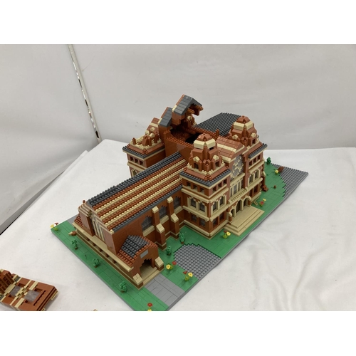 211 - A QUANTITY OF SMALL LEGO STYLE BRICKS AND BASE BUILT AS A TOWN HALL