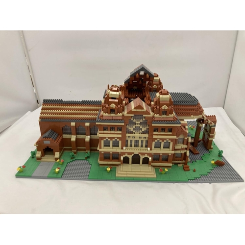 211 - A QUANTITY OF SMALL LEGO STYLE BRICKS AND BASE BUILT AS A TOWN HALL
