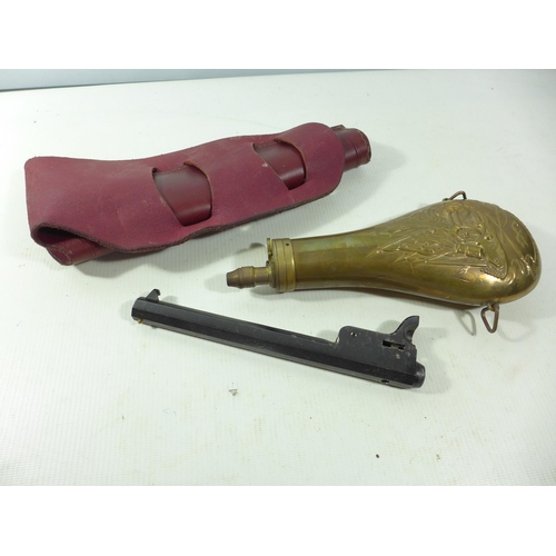335 - A COPPER AND BRASS POWDER FLASK, LEATHER HOLSTER AND A BLOCKED NAVY COLT BARREL (3)
