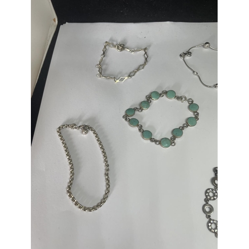 508 - FIVE SILVER BRACELETS TO INCLUDE A TURQOISE STONE AND A CLEAR STONE