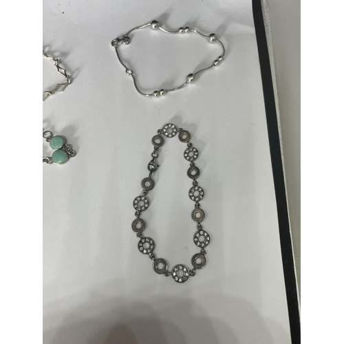 508 - FIVE SILVER BRACELETS TO INCLUDE A TURQOISE STONE AND A CLEAR STONE