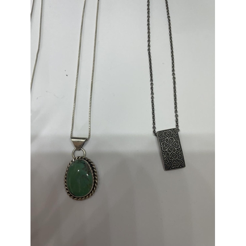 516 - FOUR MARKED SILVER NECKLACES WITH PENDANTS TO INCLUDE A CLEAR STONE BALL AND A GREEN STONE