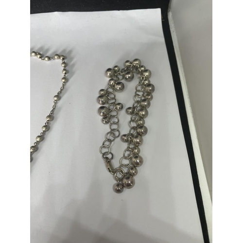 517 - A MARKED SILVER ROSARY AND BRACELET