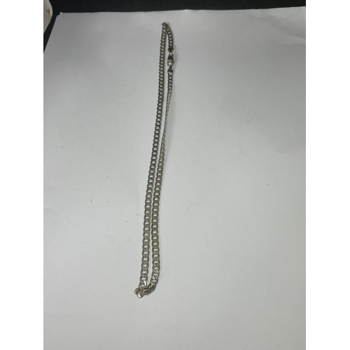 527 - TWO MARKED SILVER NECKLACES TO INCLUDE A FIGARO STYLE AND A FLAT CURB LINK