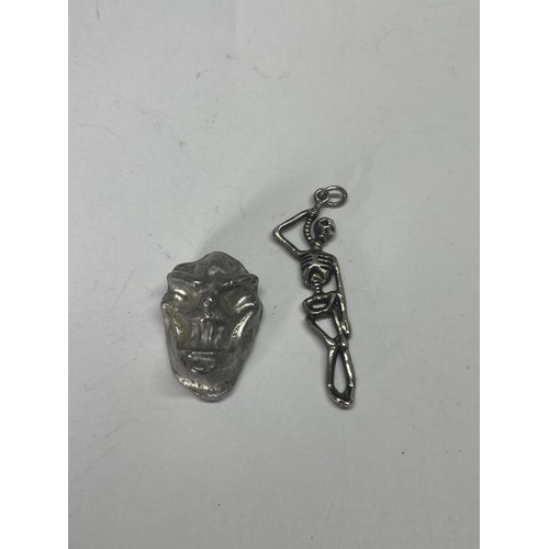 536 - A SILVER SKULL AND SKELETON