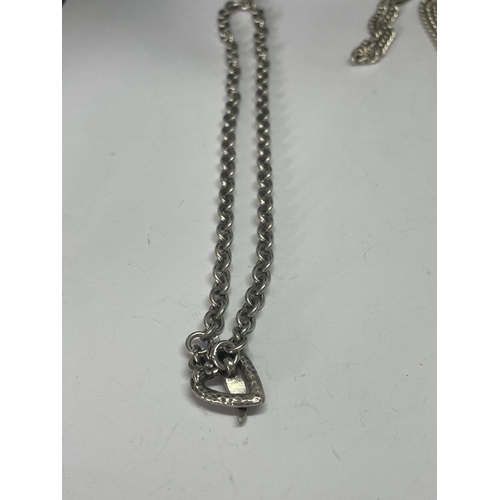 559 - TWO TWO HEAVY SILVER NECKLACES ONE WITH A RECTANGULAR LOCKET