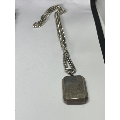 559 - TWO TWO HEAVY SILVER NECKLACES ONE WITH A RECTANGULAR LOCKET