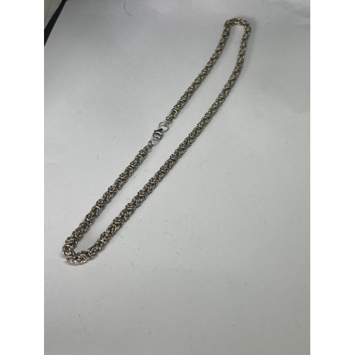 560 - A MARKED SILVER ORNATE NECKLACE