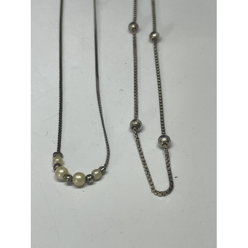 561 - FOUR SILVER NECKLACES WITH BALL DESIGN