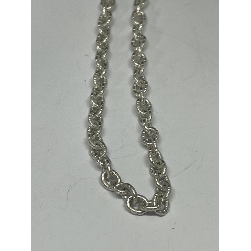 563 - TWO MARKED SILVER NECKLACES ONE WITH AN ABSTRACT PENDANT