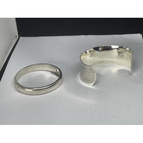 590 - TWO MARKED SILVER BANGLES