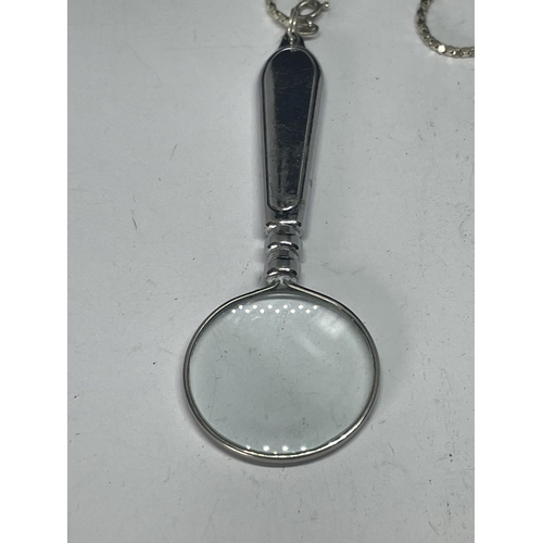 591 - A MARKED SILVER NECKLACE WITH A MAGNIFYING GLASS