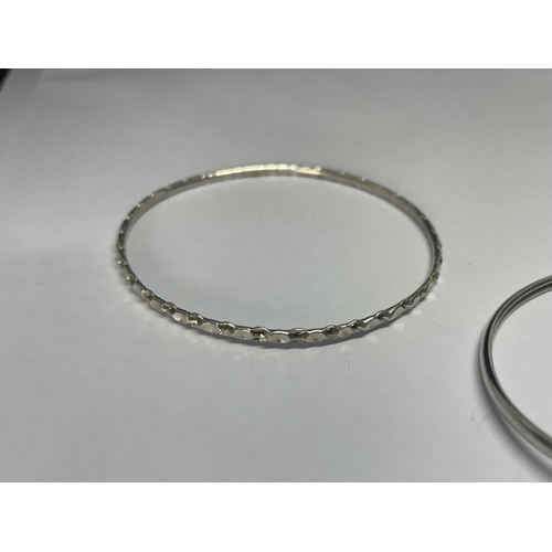 605 - TWO MARKED SILVER BANGLES