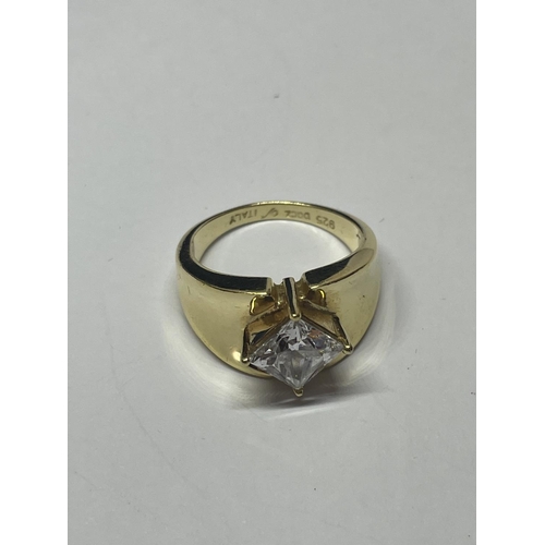 606 - A SILVER GILT RING WITH CLEARSTONE AND A PAIR OF EARRINGS