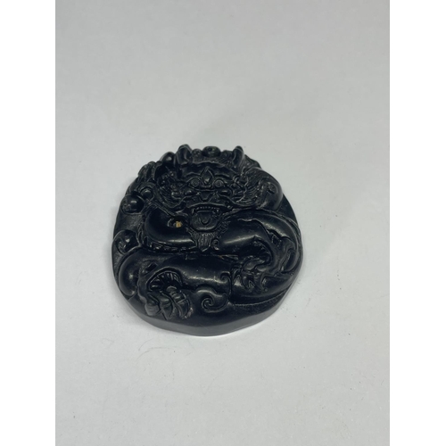 618 - A WHITBY JET CARVED FOB