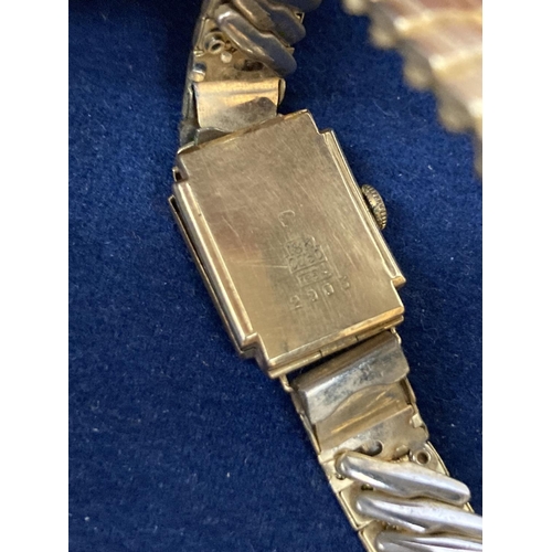 512 - AN 18CT GOLD CASED LADIES WATCH ON A ROLLED GOLD BRACELET