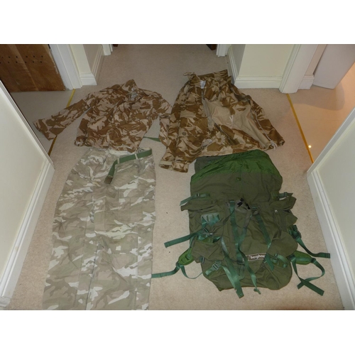 378 - A BERGHANS KIT BAG AND A LARGE COLLECTION OF DESERT CAMOUFLAGE UNIFORMS