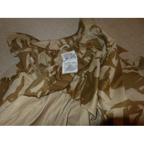 378 - A BERGHANS KIT BAG AND A LARGE COLLECTION OF DESERT CAMOUFLAGE UNIFORMS