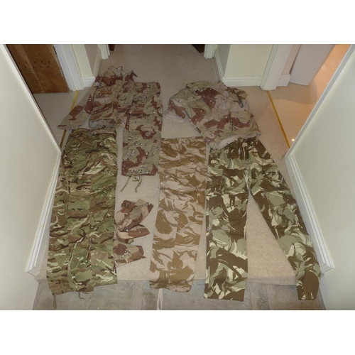 378 - A BERGHANS KIT BAG AND A LARGE COLLECTION OF DESERT CAMOUFLAGE UNIFORMS