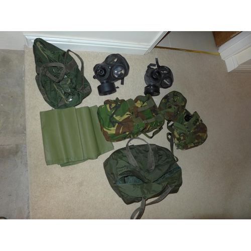 381 - TWO MILITARY GAS MASKS AND CAMOUFLAGED BAGS, FURTHER BAG ETC