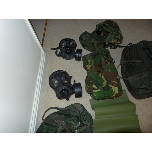 381 - TWO MILITARY GAS MASKS AND CAMOUFLAGED BAGS, FURTHER BAG ETC