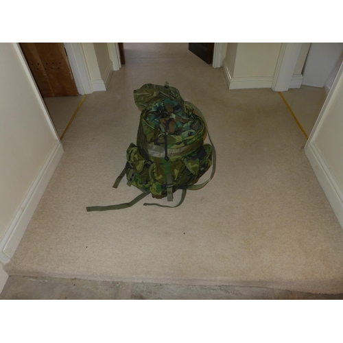 387 - A COLLECTION OF MILITARY/SHOOTING/FISHING CAMOUFLAGE UNIFORMS AND A MILITARY RUCKSACK