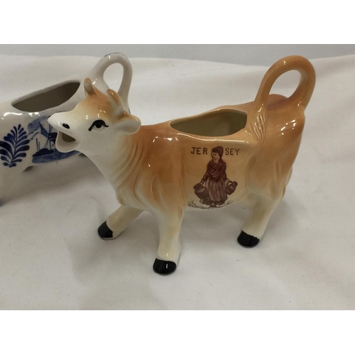 110 - A DELFT BLUE HANDPAINTED COW CREAMER AND A JERSEY COW CREAMER