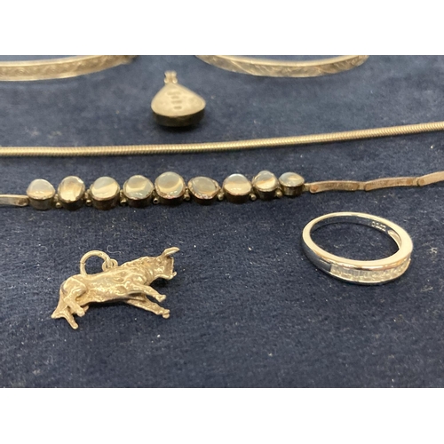 638 - SEVEN ITEMS OF SILVER TO INCLUDE TWO SILVER ID BRACELETS, A SILVER RING, TWO SILVER PENDANTS AND TWO... 