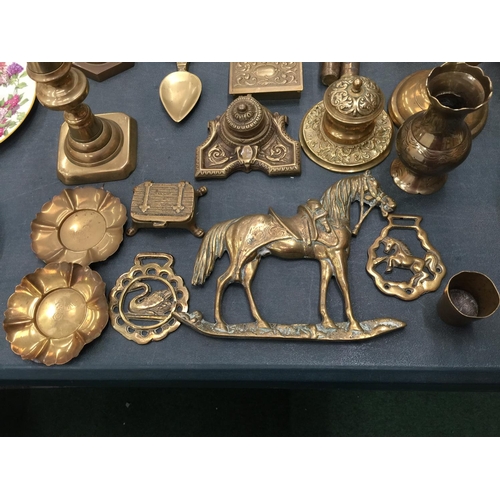 65 - A LARGE QUANTITY OF BRASSWARE TO INCLUDE CANDLESTICKS, INKWELLS, PHOTO FRAMES, ANIMALS, TRINKET BOXE... 